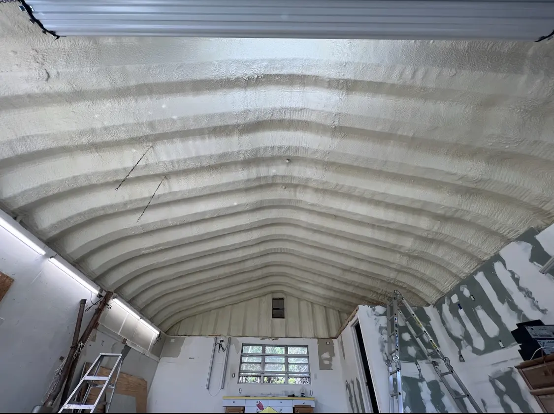 Spray polyurethane foam applied to the underside of a metal roof deck in Lockwood